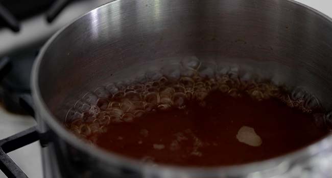boiling vinegar and sugar together in a pot