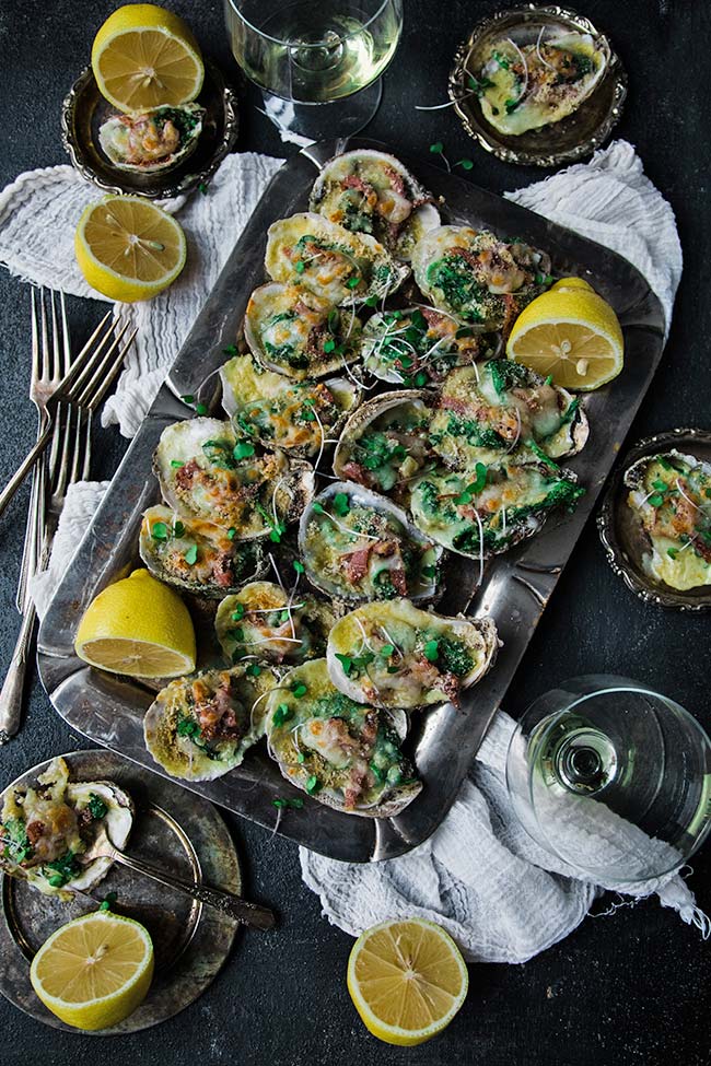 Oyster appetizer recipe served with white wine on a tray
