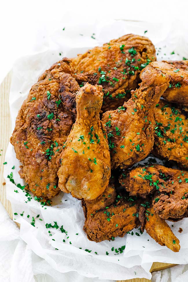 deep fried chicken recipe served on a cutting board with parchment paper