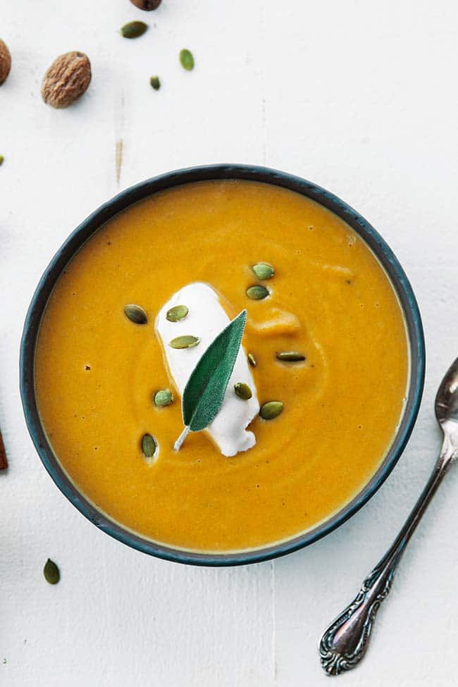 butternut soup in a bowl with a spoon