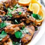 fire roasted chicken wings with sauce and herbs