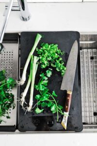 chopping herbs on the frank chef center cutting board attachment