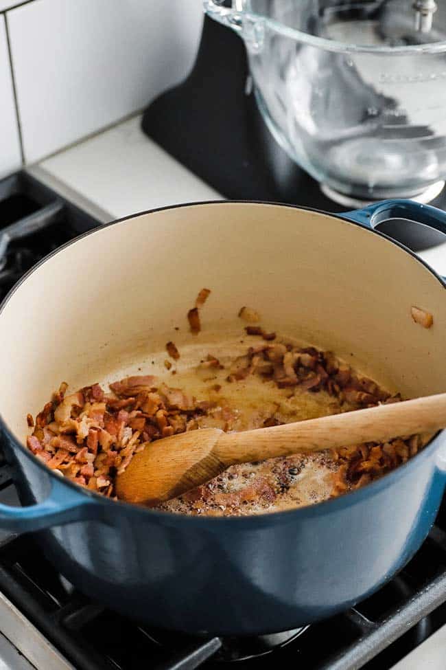chopped up bacon getting crisp in a large pot