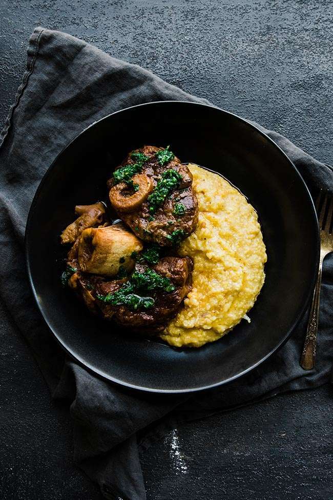 osso bucco recipe with gremolata and polenta on a plate