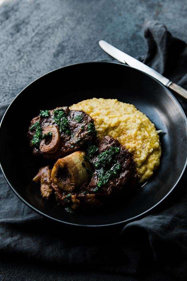 veal osso bucco recipe with gremolata and creamy polenta in a bowl