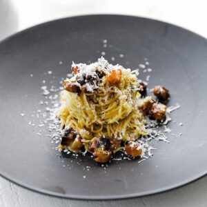 pasta with bacon and cheese on a plate