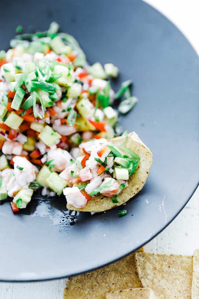 shrimp ceviche with green onions, pineapple and peppers served with tortilla chips