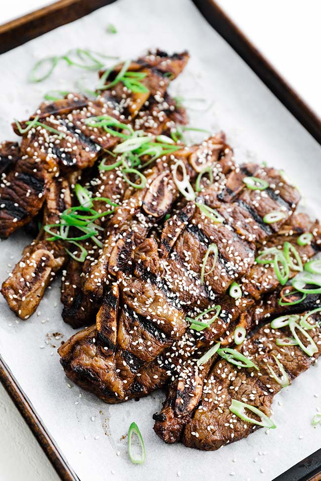 grilled kalbi with sesame seeds and green onions