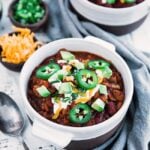 chili con carne with toppings in a large bowl