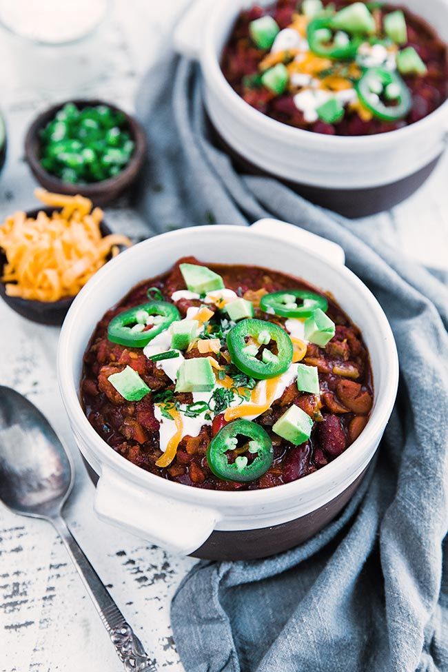 chili con carne with toppings in a large bowl