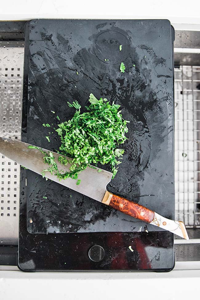 slicing green onions for beer cheese dip