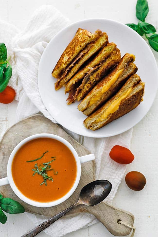 bowl of tomato soup bisque with grilled cheese