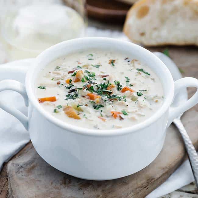 bowl of chicken and wild rice soup with a spoon