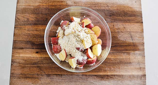 coating potatoes in parmesan