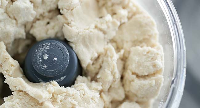 pulsing the pie crust dough in a food processor