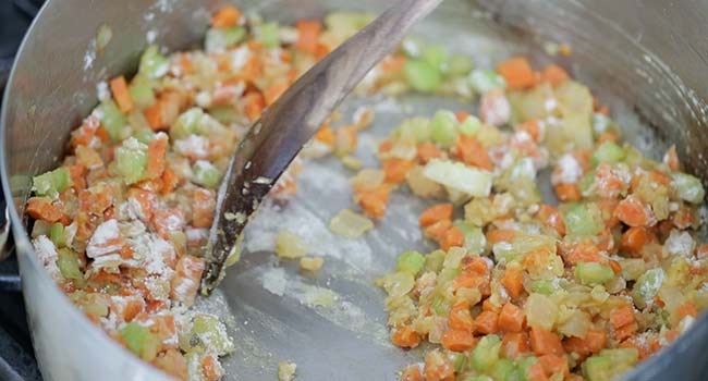 making a roux with flour and vegetables