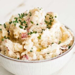 horseradish mashed potatoes in a bowl with chives