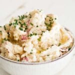 horseradish mashed potatoes in a bowl with chives