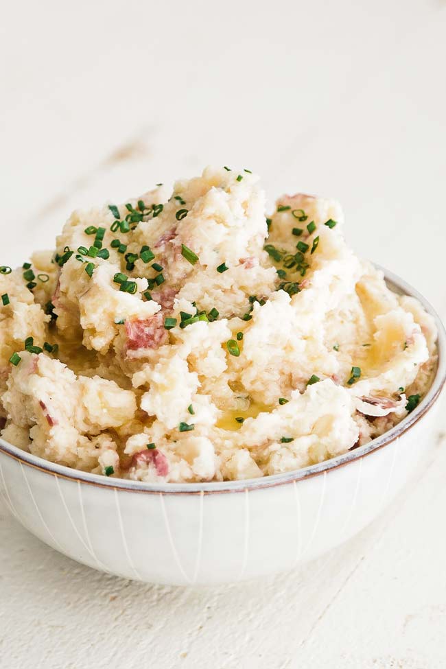horseradish mashed potatoes in a bowl with chives