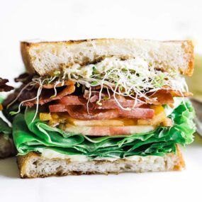 toasted BLT sandwich with lettuce, tomatoes, and bacon