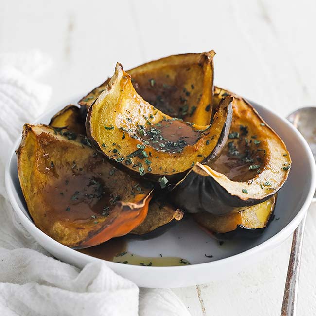 bowl of roasted acorn squash with sage