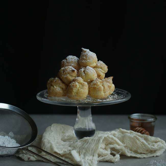 platter of stacked cream puffs