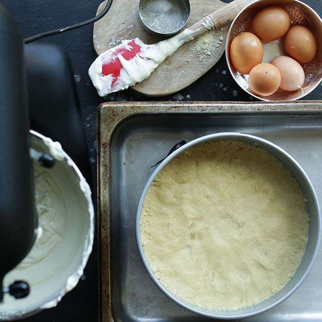 mixing the ricotta cheesecake batter for the crust