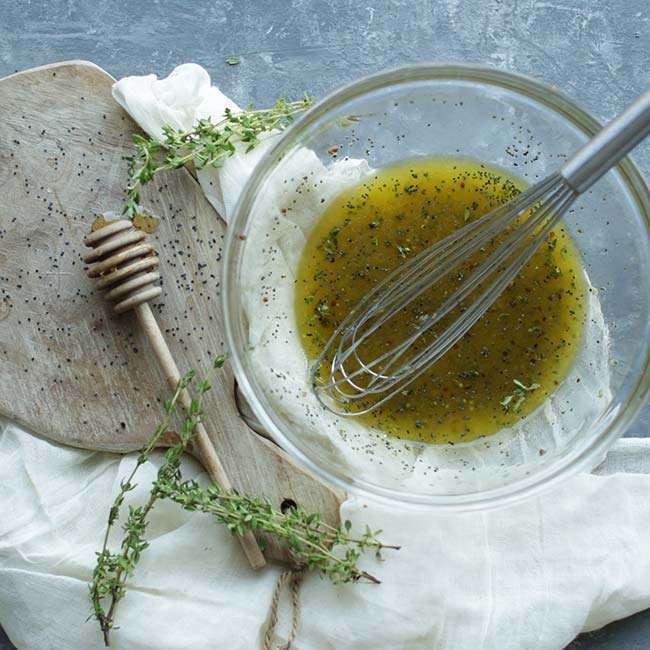 homemade vinaigrette with fresh thyme and poppy seeds
