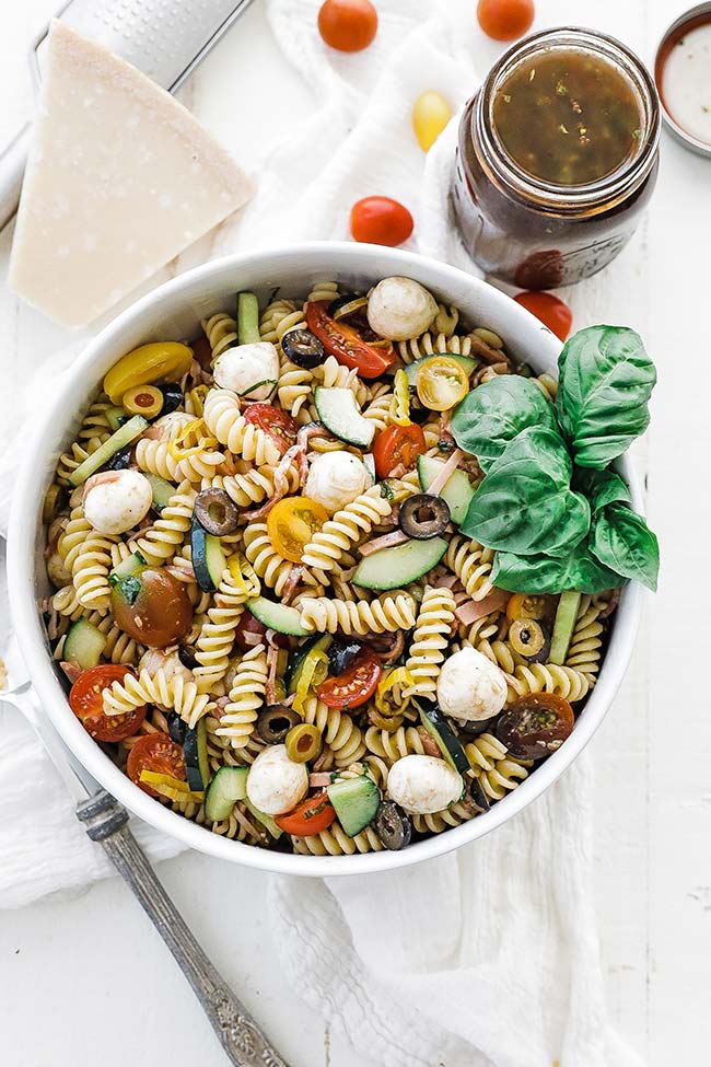 homemade pasta salad with tomatoes, herbs, cheese, and balsamic vinaigrette