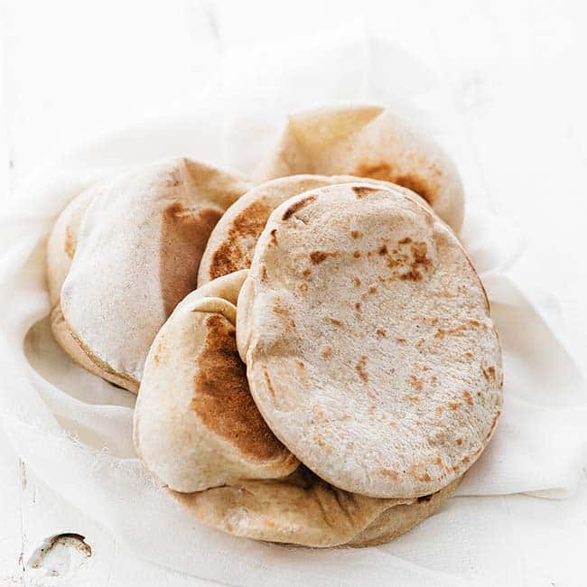 pita bread stacked up in a cloth