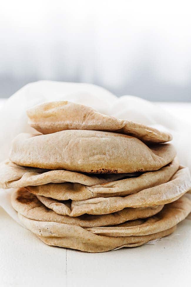 stack of pita bread pieces on a cloth