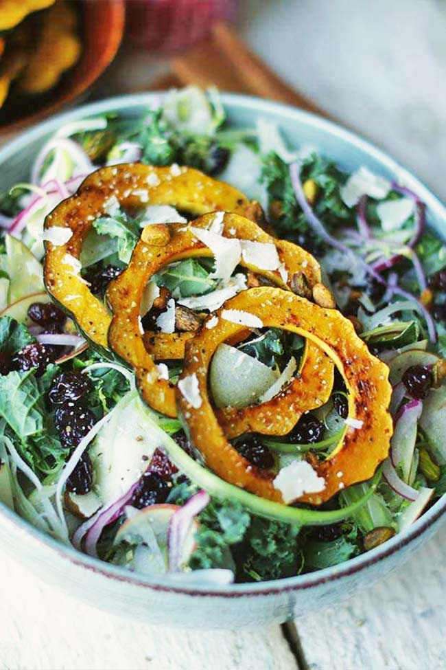 kale salad with squash in a bowl