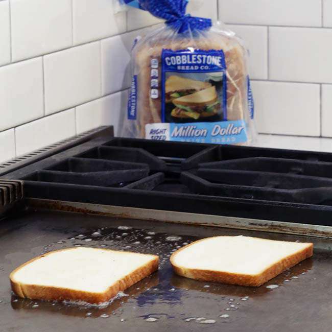 browning the bread for a chicken melt