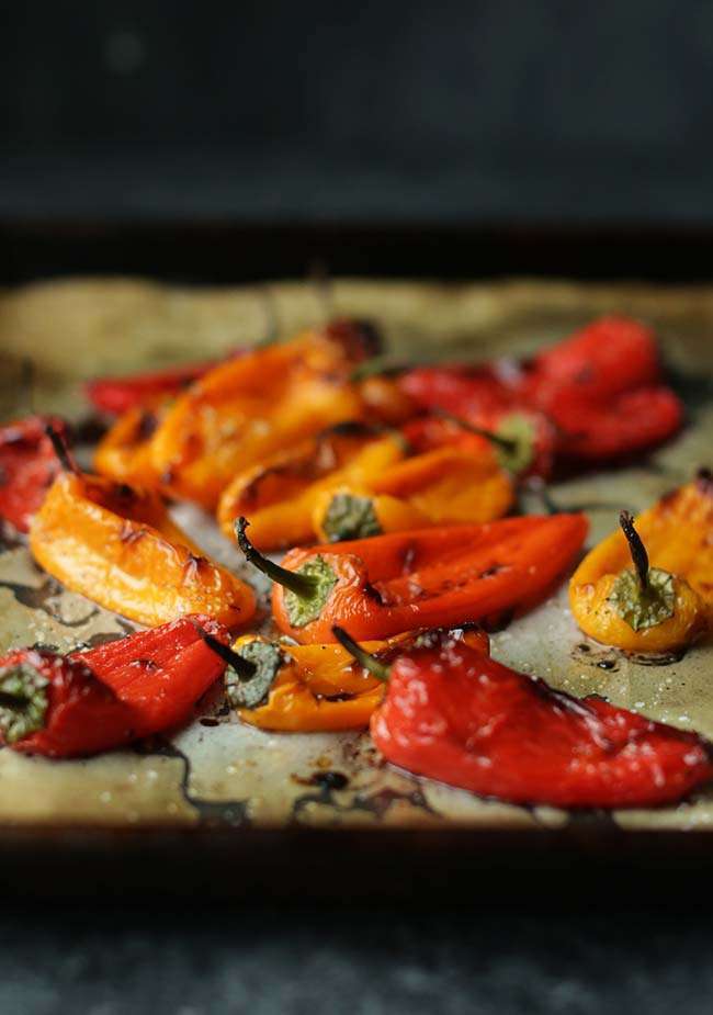roasted baby bell peppers on a sheet tray