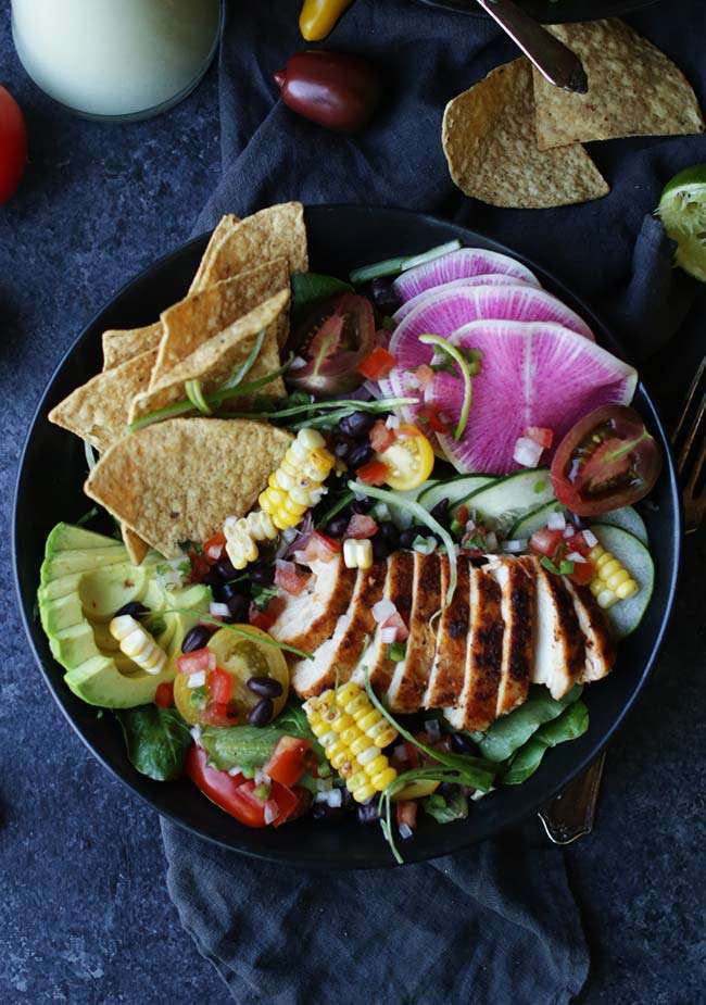 bowl of vegetables, chips, chicken and watermelon radishes to make a taco salad