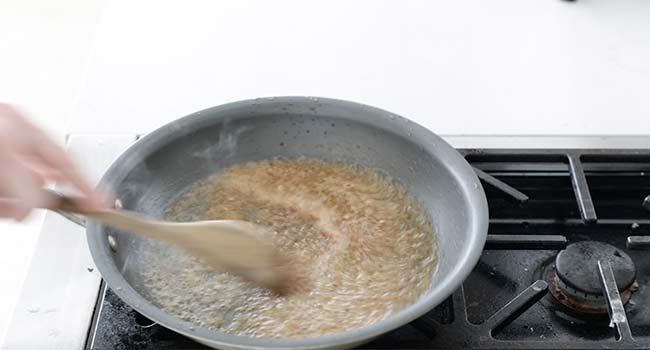 cooking shallots and garlic in wine