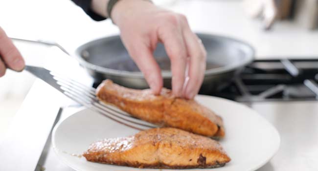 setting pan seared salmon to the side