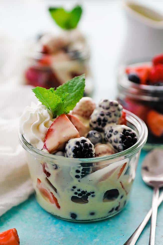 clear glass jar with sauce and berries