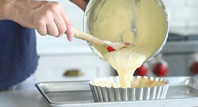 adding filling to a pie crust