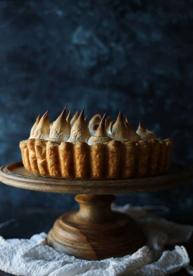 sweet potato pie on a cake stand