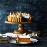 slice of sweet potato pie on a plate with marshmallow topping