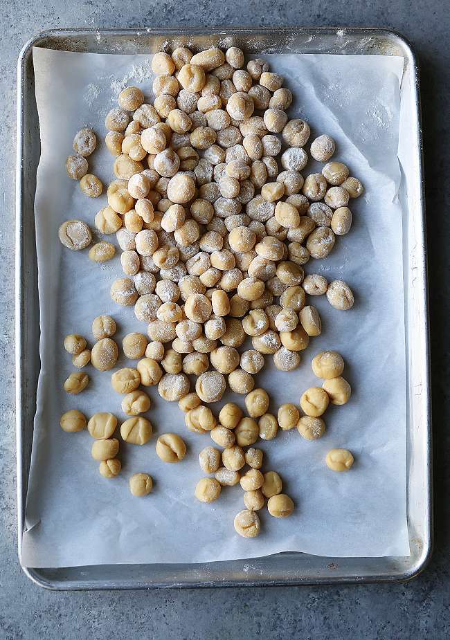 fried dough balls on parchment paper