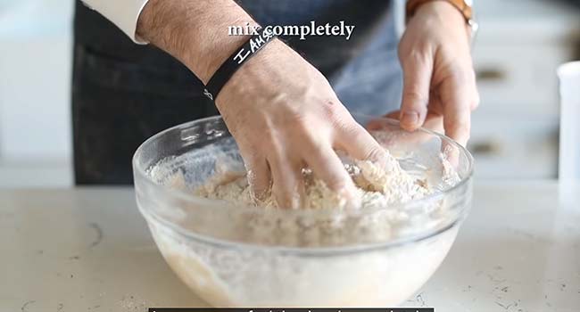 mixing together flour with water