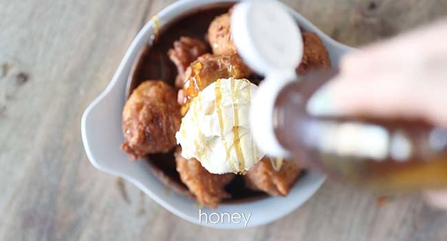 serving apple fritters with ice cream and honey