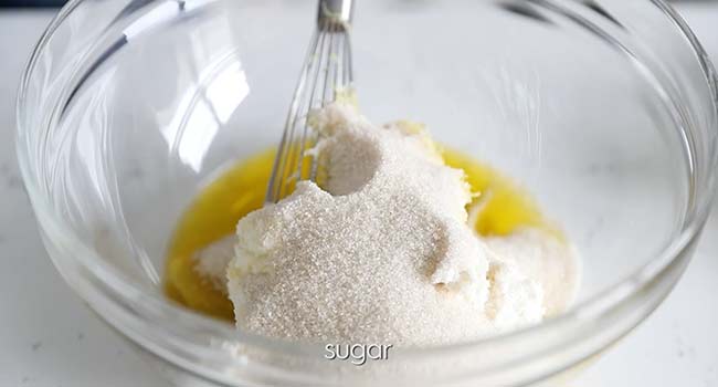 whisking together sugar and oil