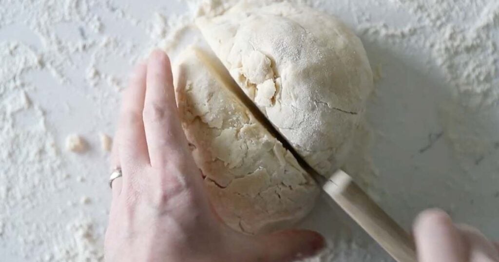 splitting a pie dough in two