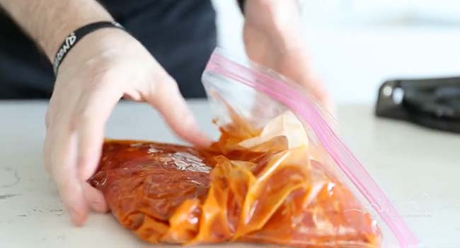 marinating flank steak in a plastic zip bag