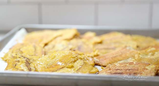 draining tostones