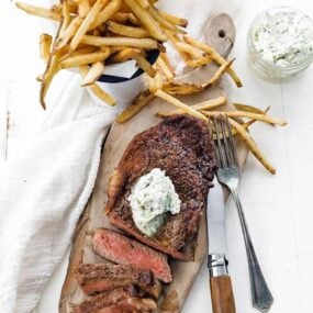 french fries with steak and herb butter