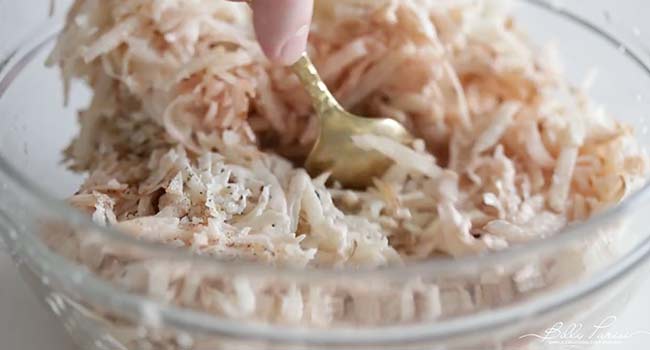 mixing potatoes with cream